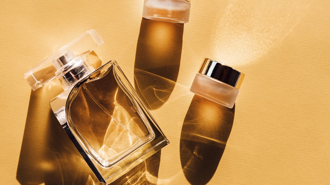 Two clear glass perfume bottles side by side, illustrating the comparison between a designer fragrance and an inspired alternative