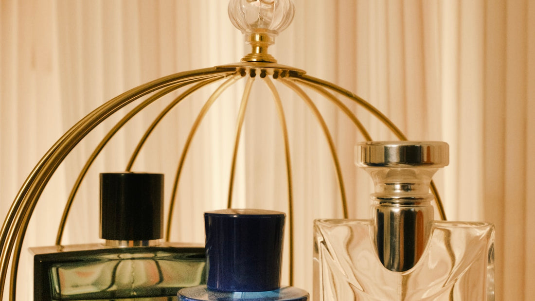 Glass table with multiple perfume bottles arranged, representing the breadth of the Chogan catalogue