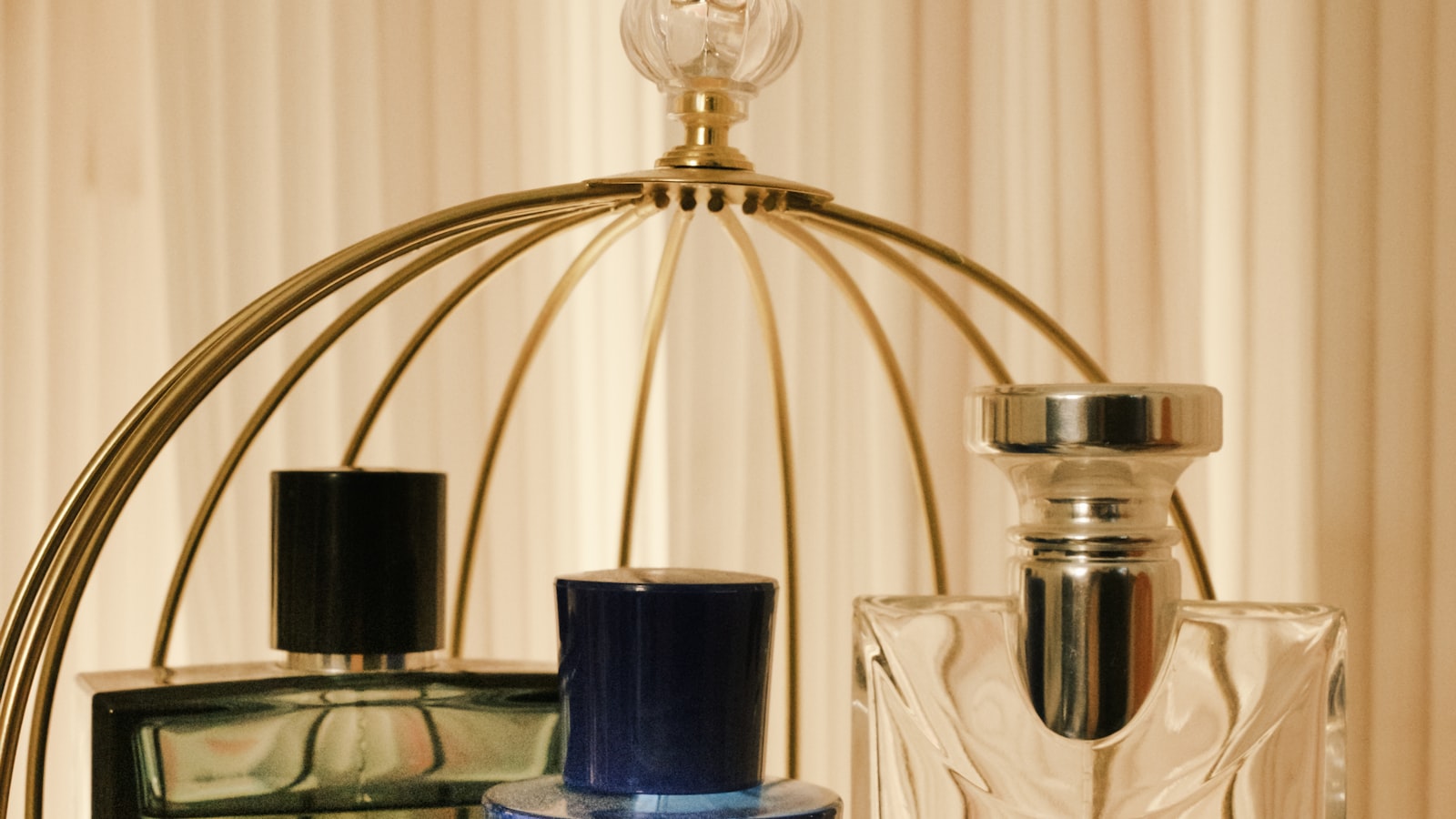 Glass table with multiple perfume bottles arranged, representing the breadth of the Chogan catalogue