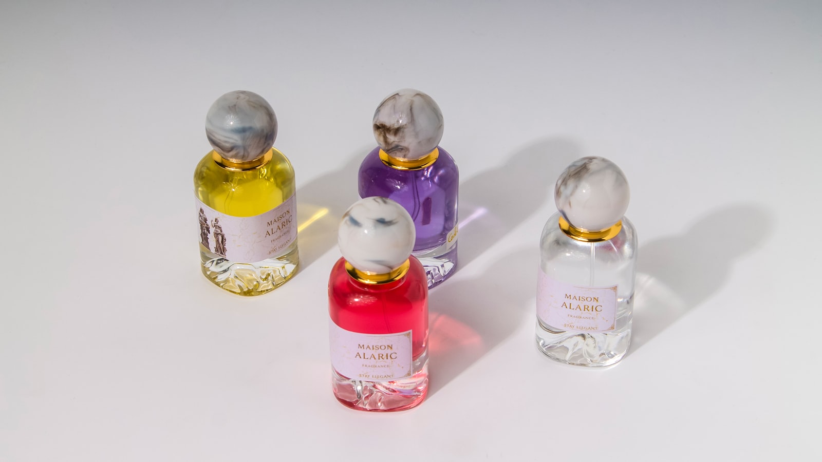 Four colourful perfume bottles displayed together, representing Scentilly's bestselling Chogan fragrances